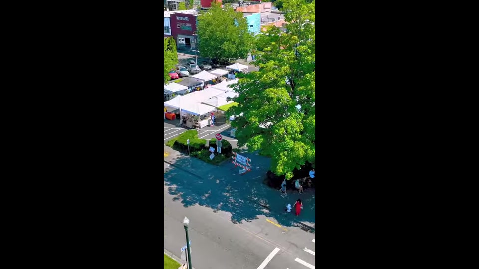 A busy Pacific Northwest farmers market filmed from above